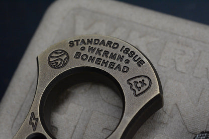 NEW WKRMN Bonehead Derpy 1/4lb Paper Weight Brass w/ Etched Brass Bead