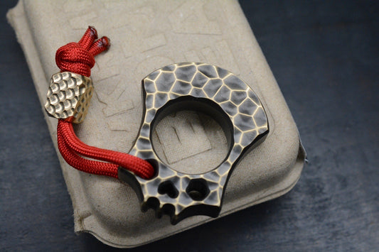 NEW WKRMN Bonehead Rock Finish 1/4lb Paper Weight Brass w/ Brass Bead