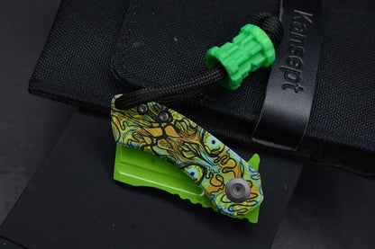 Koch x Kanscept Mini Korvid Undead G10 Green Blade w/ Koch Shamrock Bead & Patch