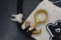 RARE Delicious Fist Brass Drop Anchor Brass Bottle Opener w/ White Molar Bead